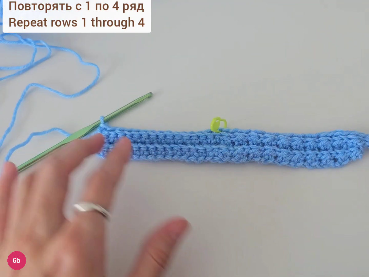 Long blue ribbed strip laid flat with a hook beside it and the text Repeat rows 1 through 4