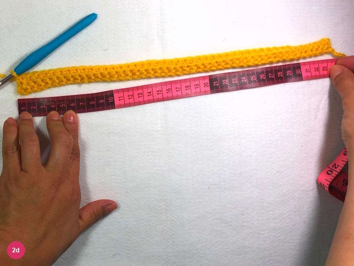 First yellow row laid beside a pink tape measure whose far end reads about 33