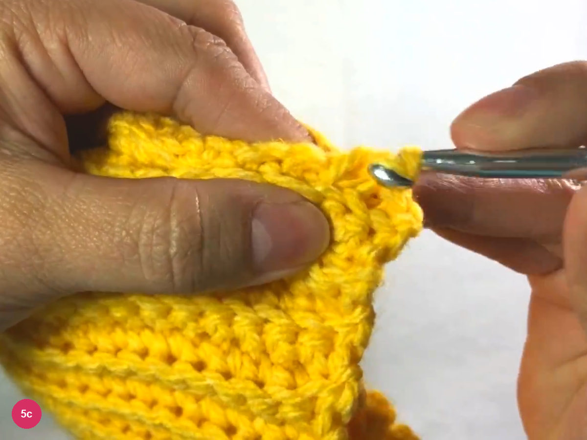 Slip stitch seam growing along the joined edge as the hook works the next stitch