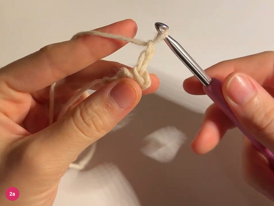 New turning chain and narrow cream tie below the hook