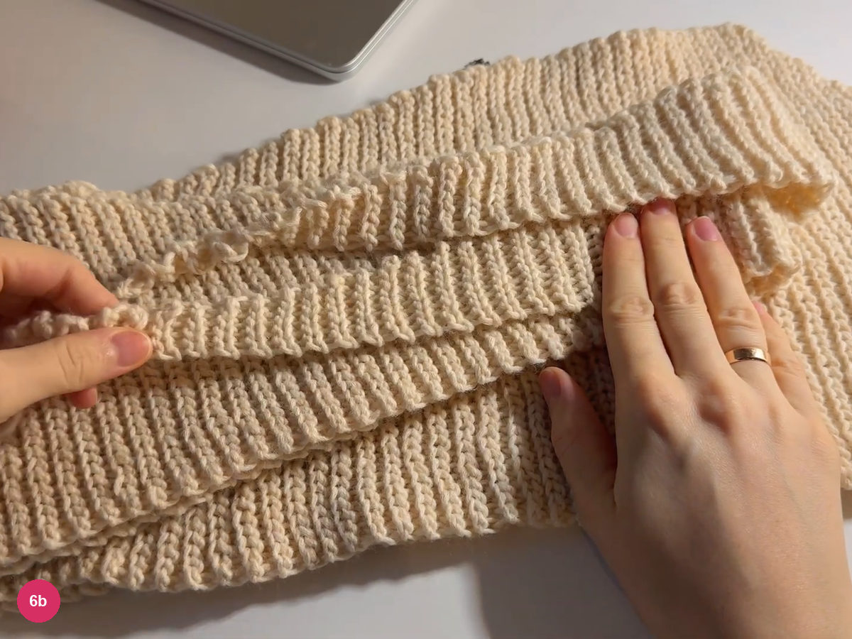 Two cream ribbed tie sections folded together for comparison