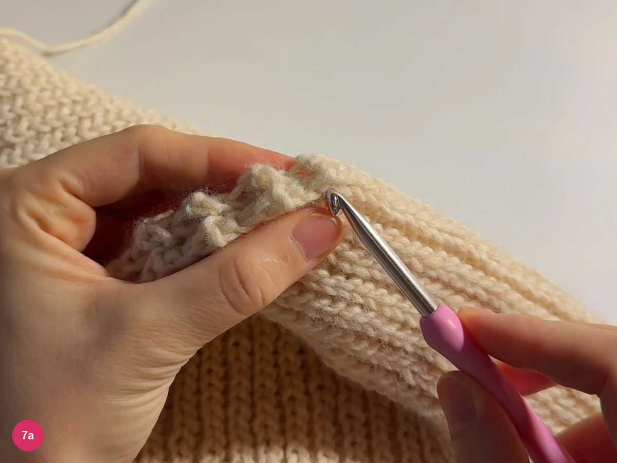 Two cream crown edges brought together beside the hook