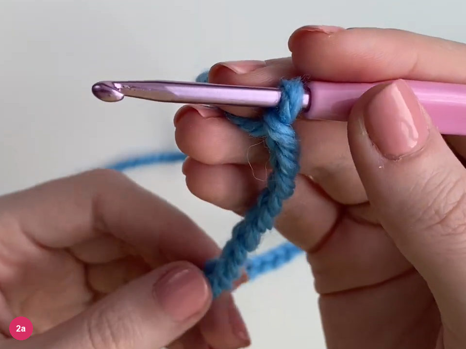 Pink-handled purple hook holding the blue foundation chain