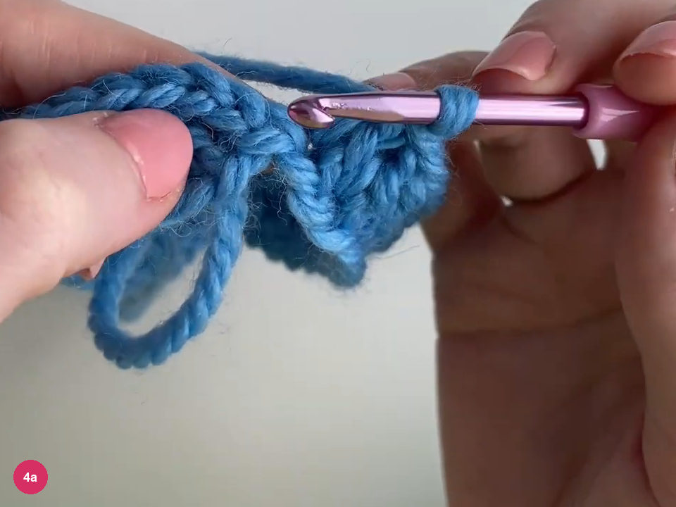 Purple hook inserted at the top of the blue starting chain