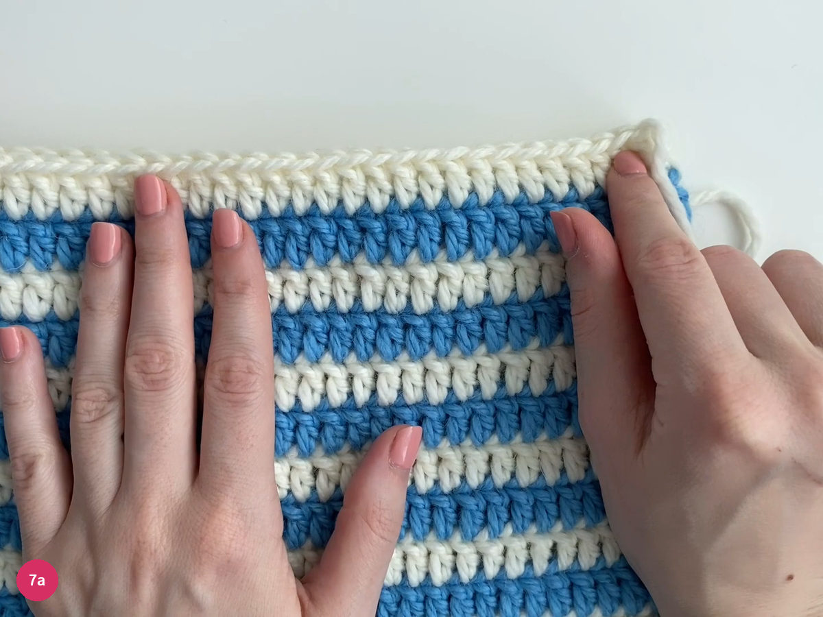 Hat body flattened with the white top edges aligned horizontally