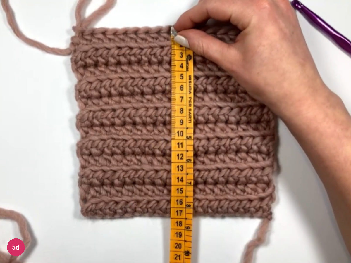 Square ribbed panel of about a dozen rows lying flat with an orange tape measure laid over it from top to bottom