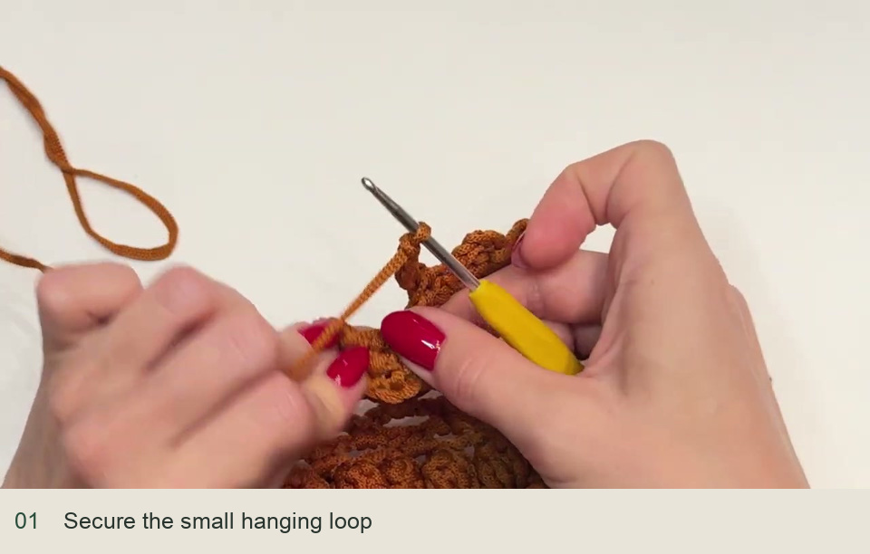 Add the loop and inspect the pocket: Secure the small hanging loop