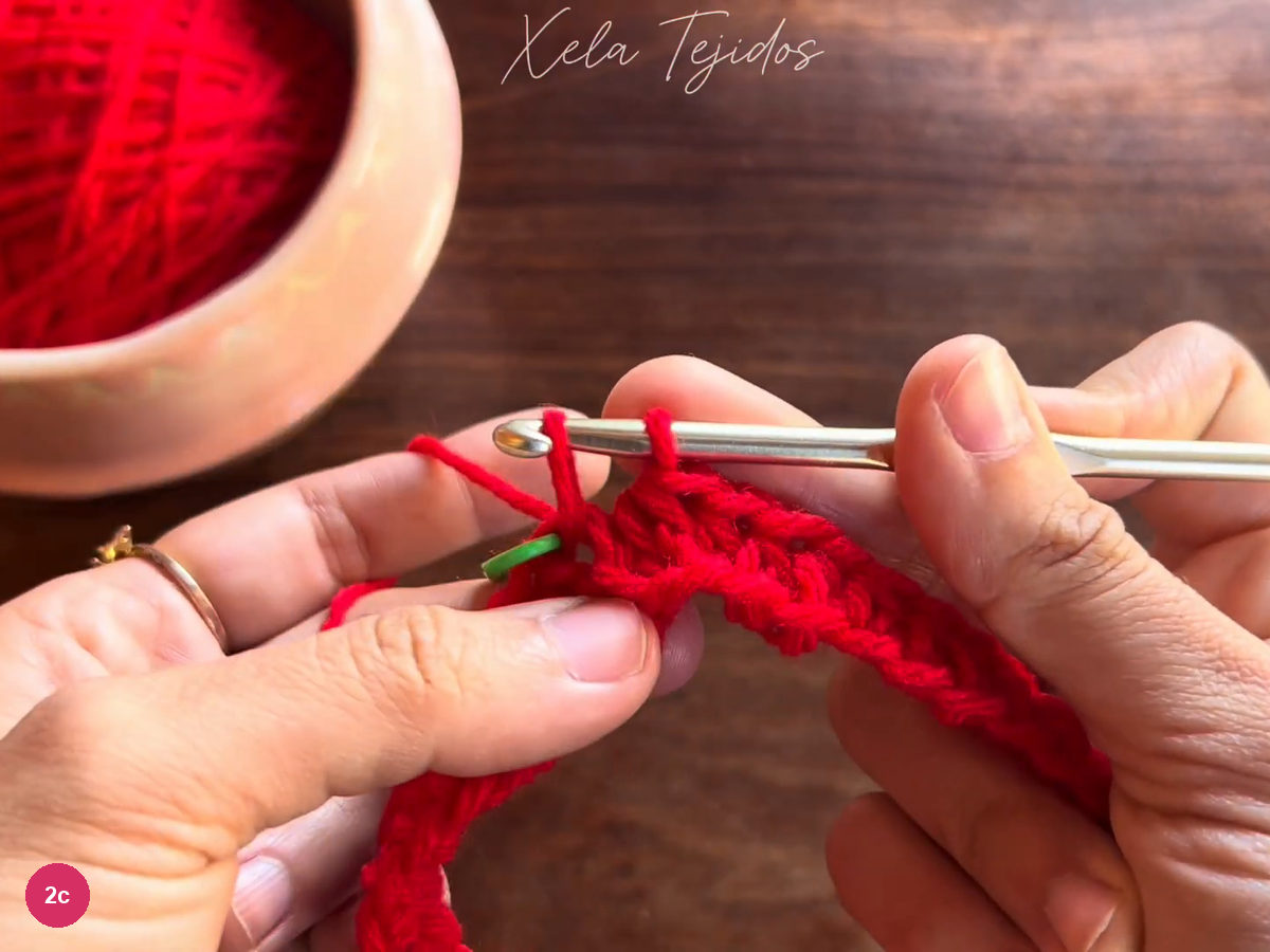 Hook joining the red body round beside the green stitch marker