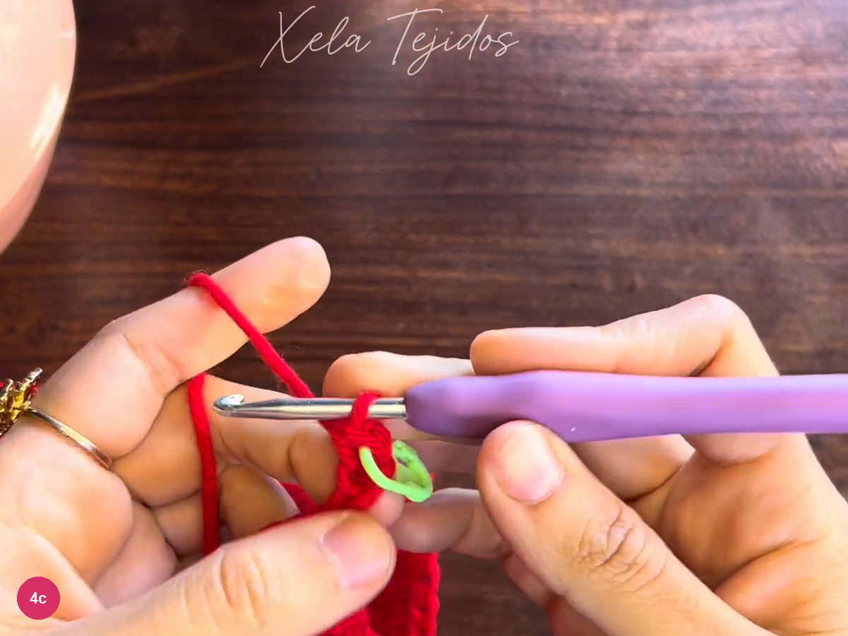 Green marker beside the first single crochet in the narrow red cuff strip