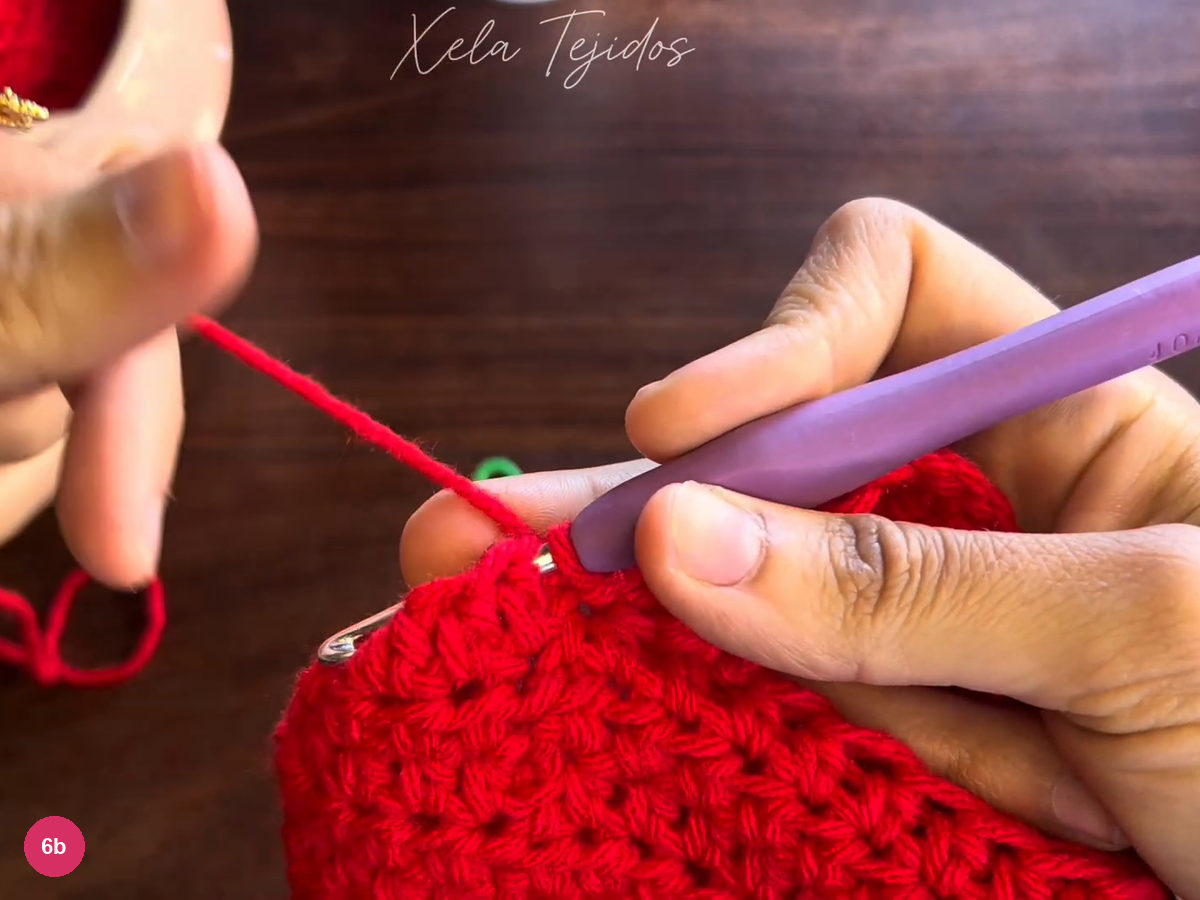 Hook joining the ribbed red cuff to the next body position