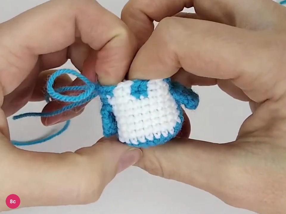 Small penguin body with stuffing added through the top