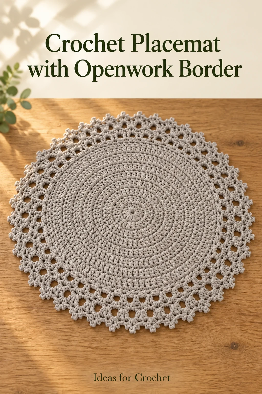 Pale gray round cotton crochet mat with a dense center and pointed openwork edging