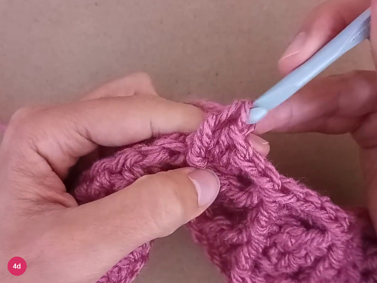Final pull-through of the outside treble beside the raised diamond band