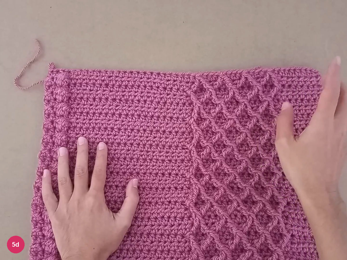 Upper portion of a completed rose rectangle with diamonds along one edge and bobbles along the other