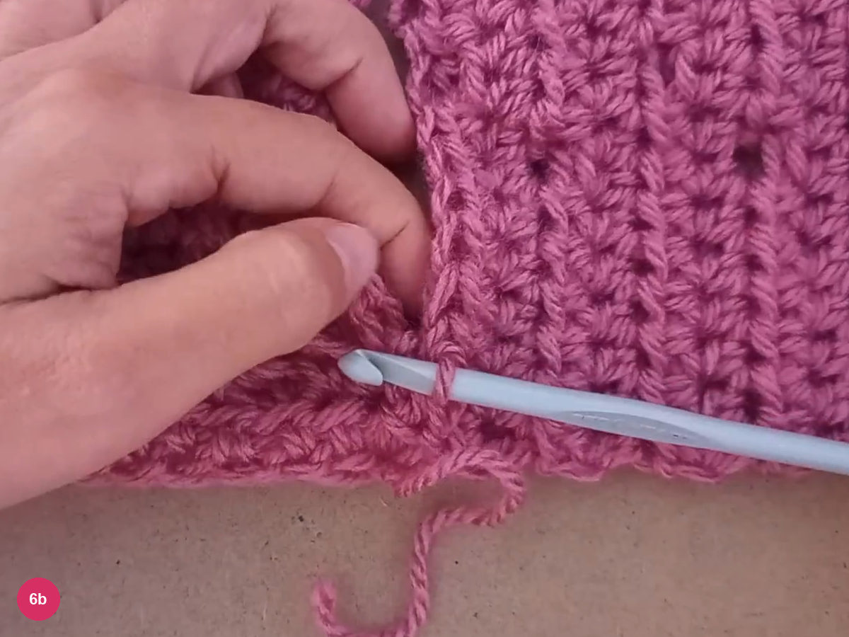 Hook passing through aligned rose panel edges along the first seam