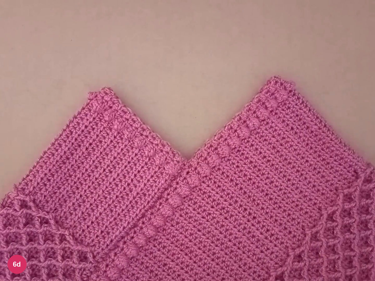 Assembled rose poncho opened out to show the central neckline and joined fabric
