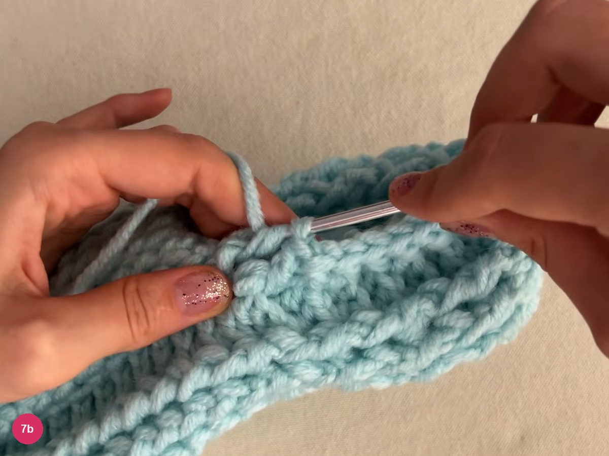 Hook at the edge where the heel part meets the body, stitches of the edge round visible below the hook