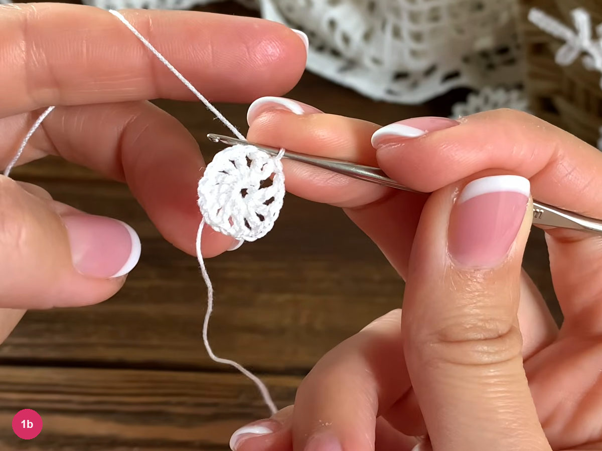 Joined white crochet center with chain spaces between its double crochet posts