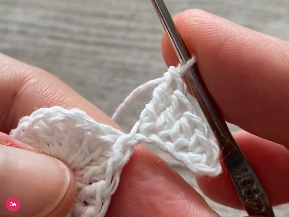 Completed graduated point with a tall stitch at its base