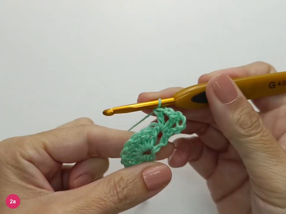 A V-stitch sits in the near edge space.