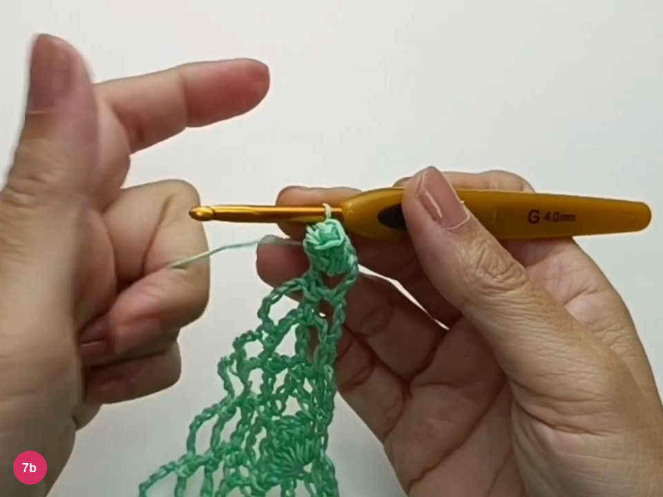 The folded posts form a raised crocheted bobble at the edge.