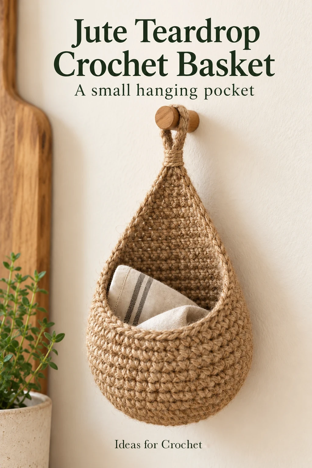 Natural jute teardrop crochet basket hanging from a wooden peg with an accurate project headline