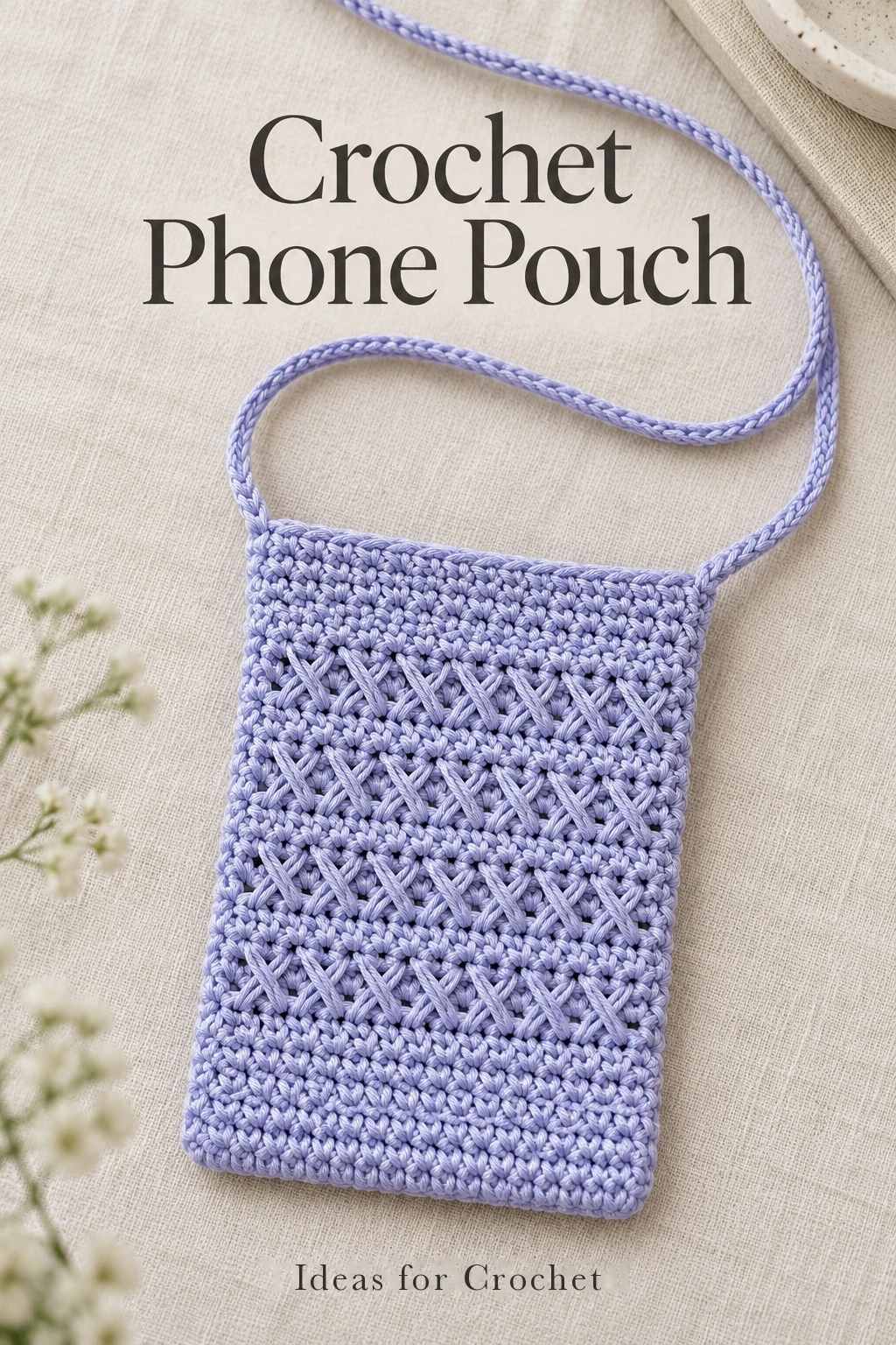 Lavender crochet phone pouch with crossed stitches and a narrow shoulder strap