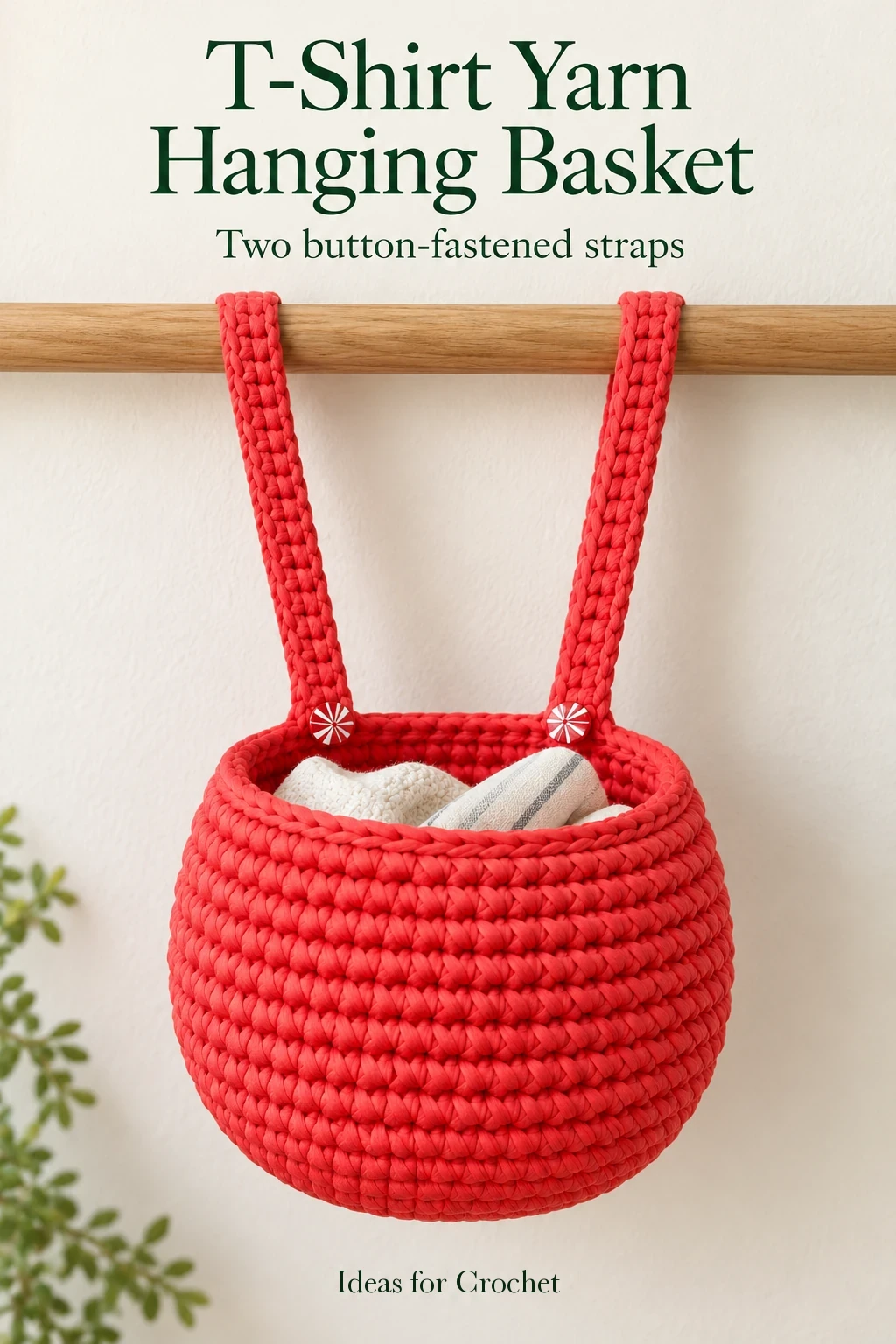Coral T-shirt yarn crochet basket hanging from two buttoned straps with a project headline